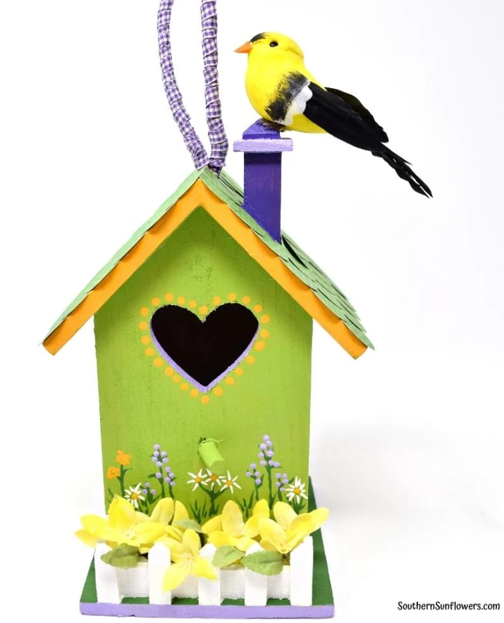 Painted birdhouse example with flowers and bird attached to it