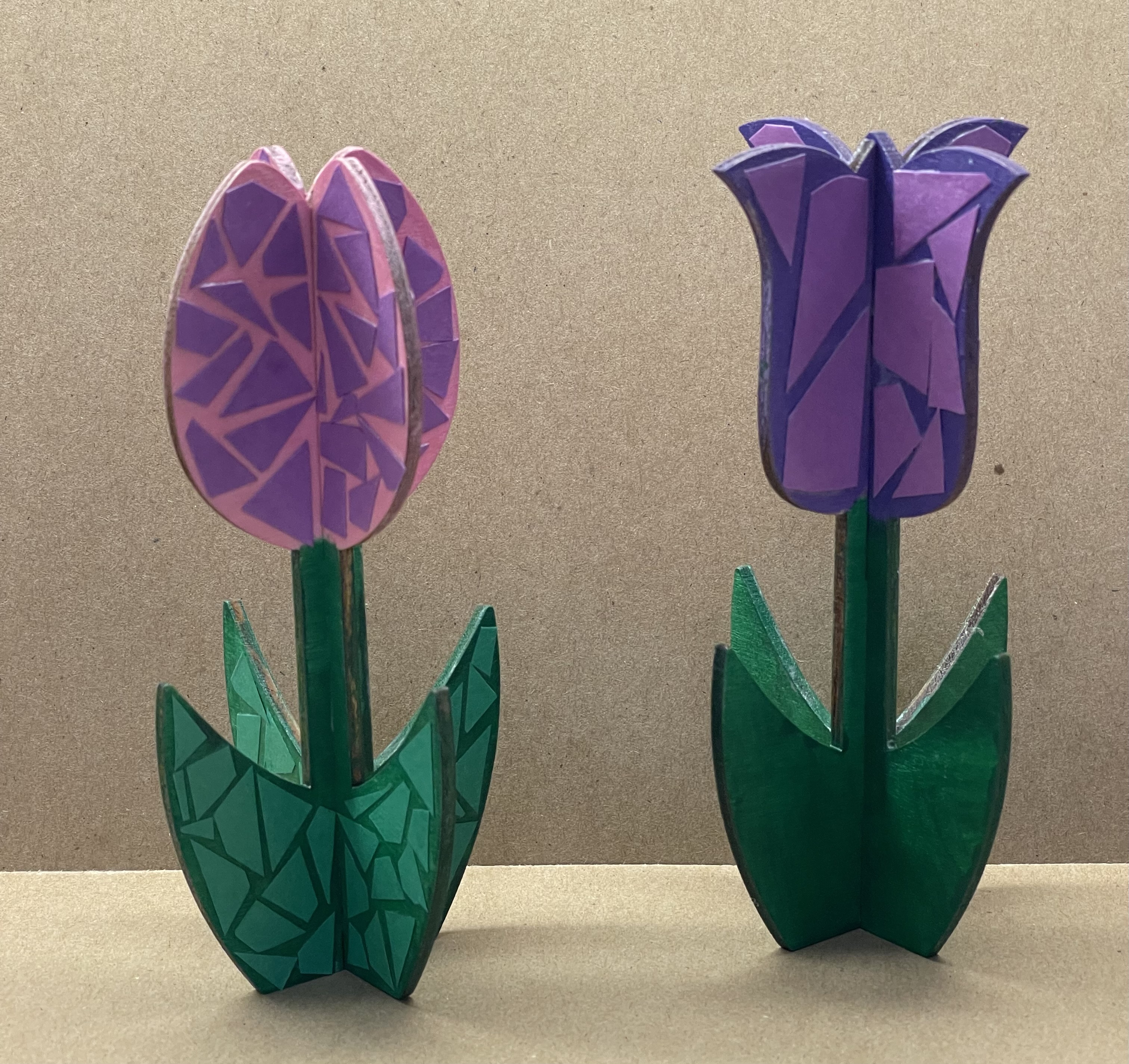 Two painted wooden 3D flowers