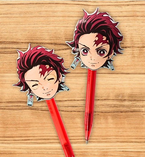 2 click pens with anime head toppers laying on a table